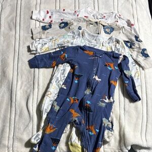 Four pack of cotton footie pjs size 9m. Carters brand and one koala baby.
